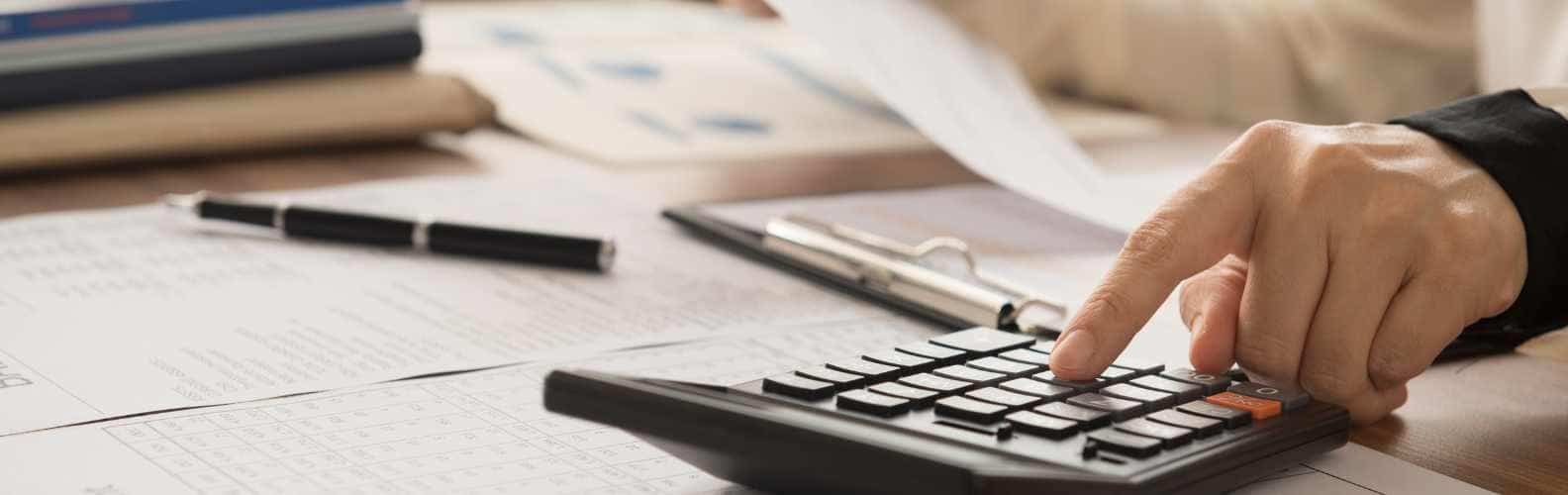 Accounting services in thailand with a hand and a calculate to count