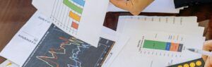 Business person analyzing financial charts and reports, representing Finance in Thailand