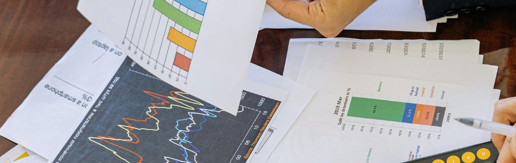 Business person analyzing financial charts and reports, representing Finance in Thailand
