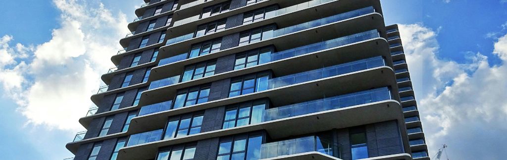 Modern condominium building in Bangkok representing a thriving Investment Company in Thailand.