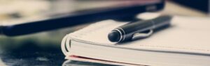 Pen resting on a legal document related to the BOI License in Thailand