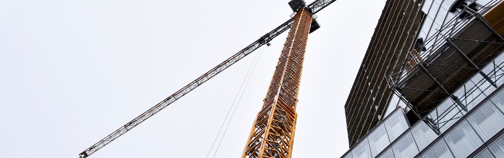 Skyscraper and crane illustrating the impact of the Building Control Act in Thailand