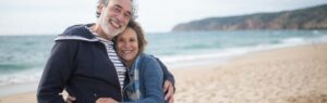 Happy senior couple enjoying retirement in Pattaya on the beach