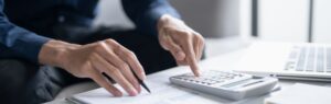 ax deduction in Thailand with man calculating expenses