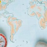 Visa run in Thailand concept with travel map, passport stamp and compass for border crossing preparation