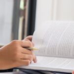 Lawyer reviewing legal documents with a client, illustrating the risks of buying property in Thailand